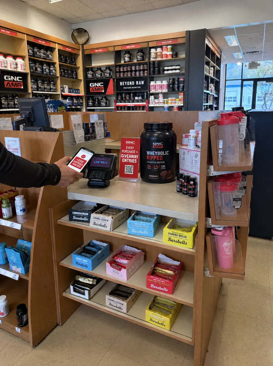 Giveaway A-frame at a GNC store entrance